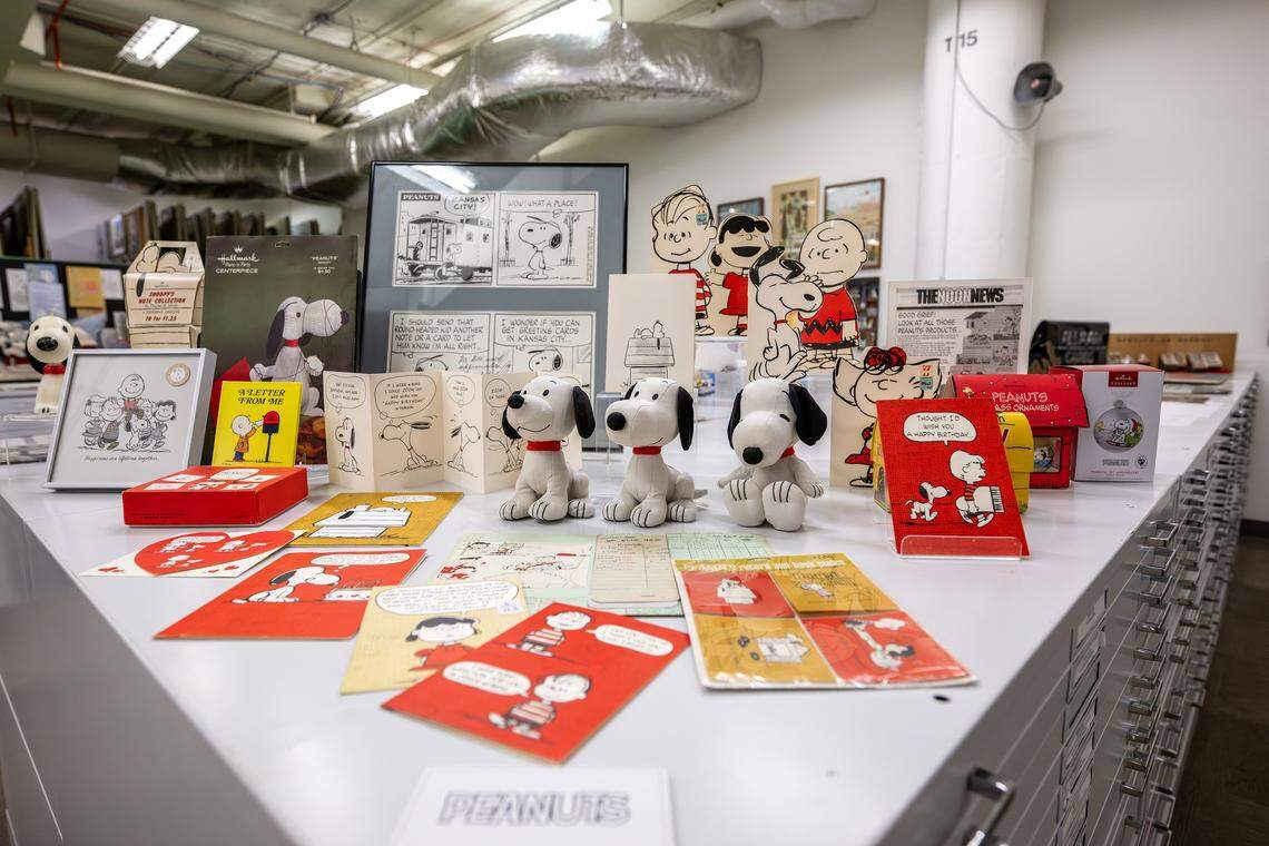 A collection of Peanuts artifacts is displayed atop file cabinets in the Hallmark archives at the Hallmark headquarters on Aug. 5 in Kansas City.