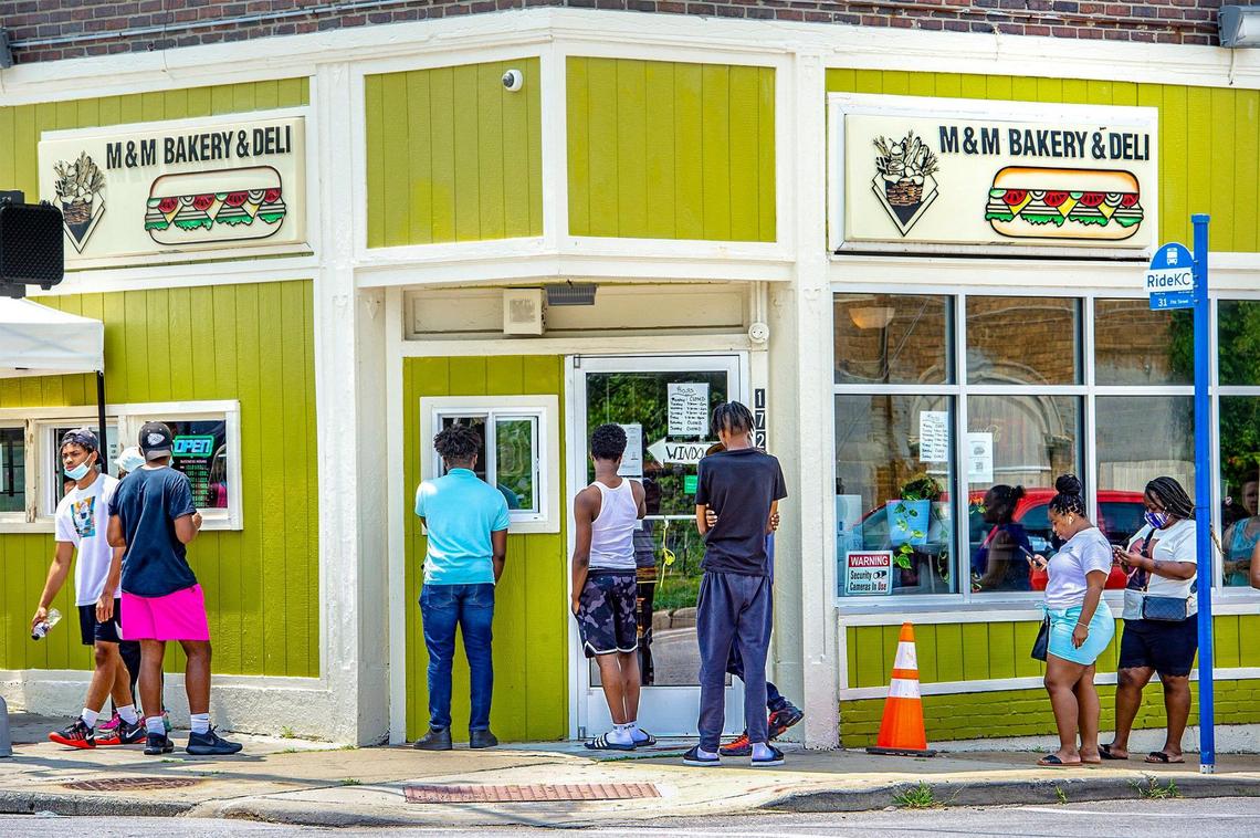 Customers place orders at a walk-up window at M&M Bakery & Deli, 1721 E. 31st St., and then pick up their food from the window on the left. M&M is known for its Hook Em’ Up sandwich.