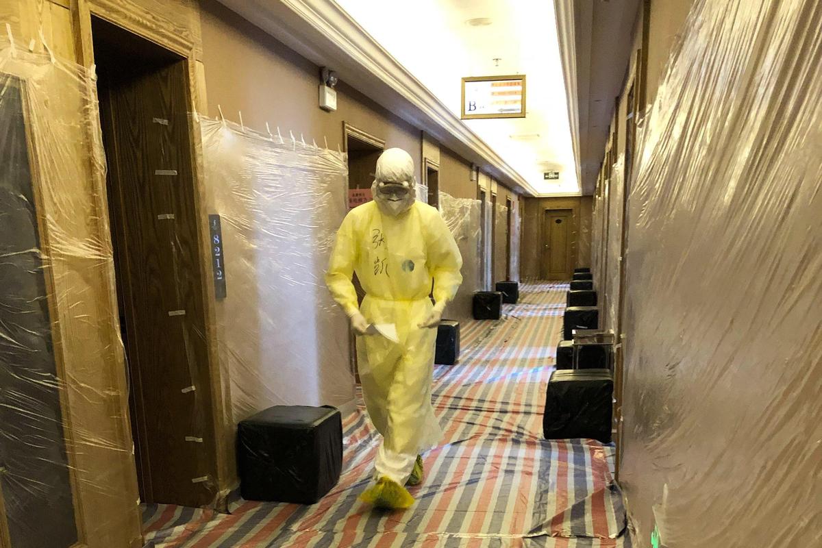 I was in a state-mandated quarantine hotel in Hohhot, China, for 14 days. The hallway was covered in plastic, for spraying disinfectant.