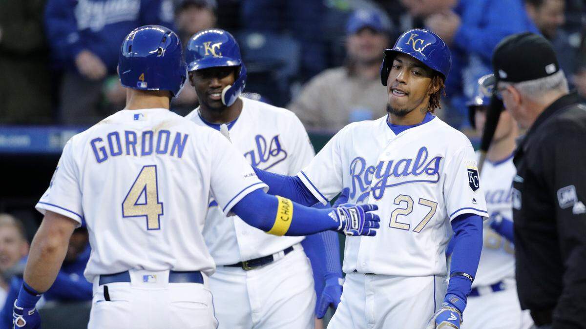 Alex Gordon (left) was congratulated at home plate by teammates Jorge Soler (center) and Adalberto Mondesi (27) after hitting a two-run home run in the first inning on Friday night at Kauffman Stadium.
