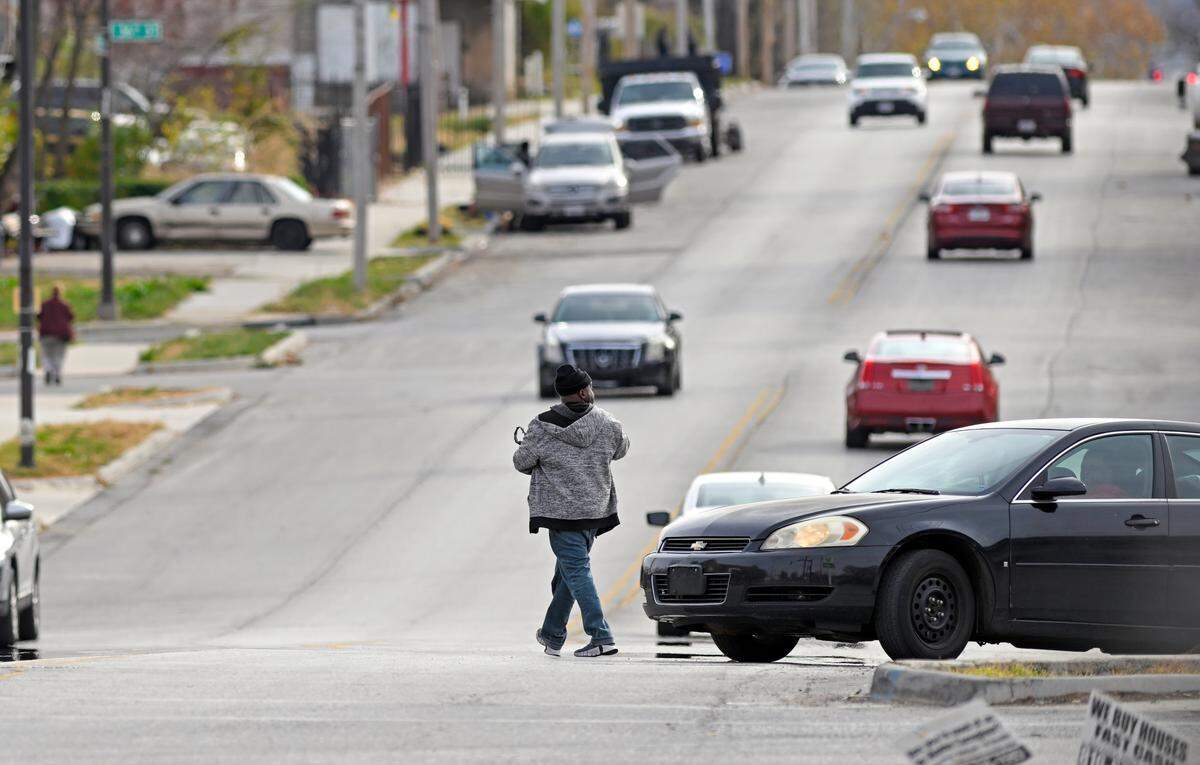 A pedestrian crosses the intersection of E. 35th Street and Prospect Avenue on Nov. 7.