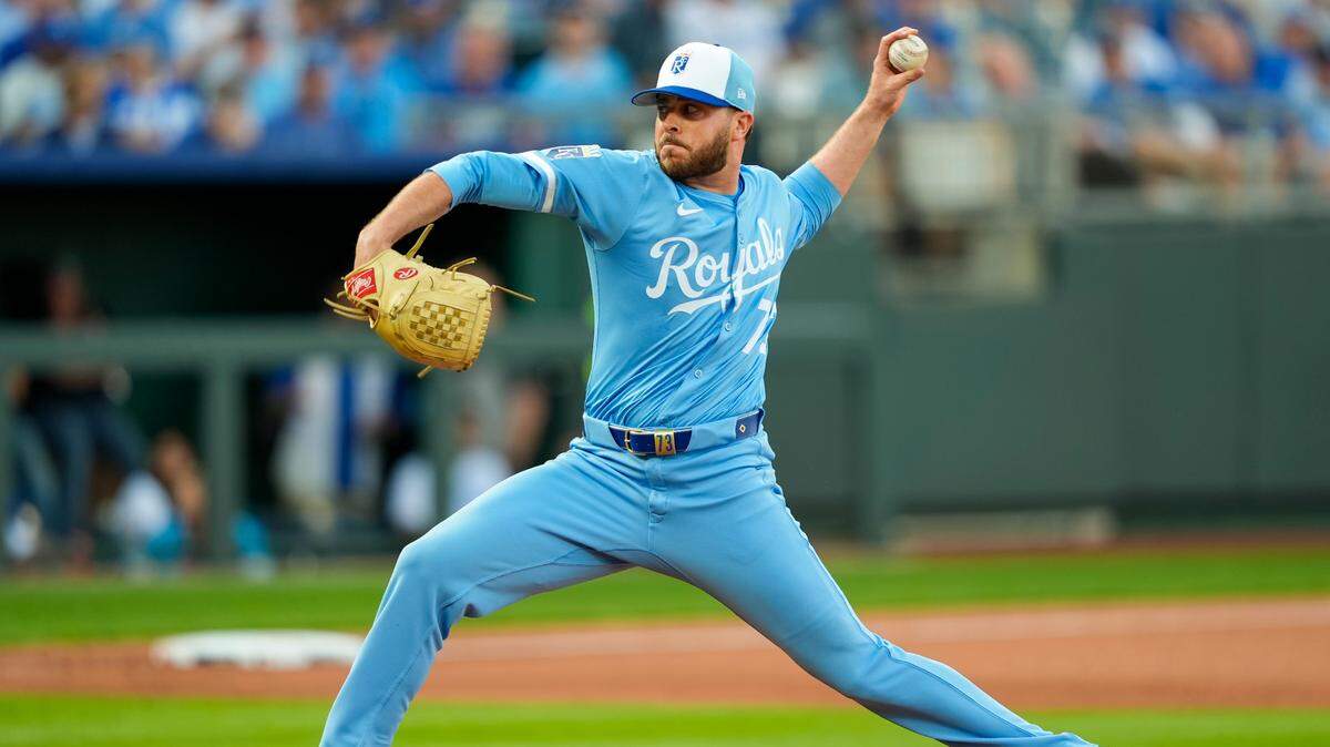 Kansas City Royals relief pitcher Sam Long (73) pitches during the tenth inning against the Cleveland Guardians at Kauffman Stadium on Mar 27, 2025 in Kansas City, Missouri, USA.