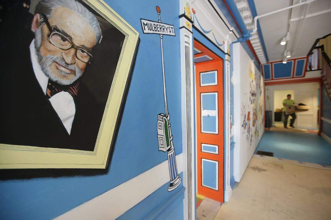 A mural featuring Theodor Seuss Geisel, aka Dr. Seuss, decorates a wall near an entrance at The Amazing World of Dr. Seuss Museum in Springfield, Massachusetts, his hometown.