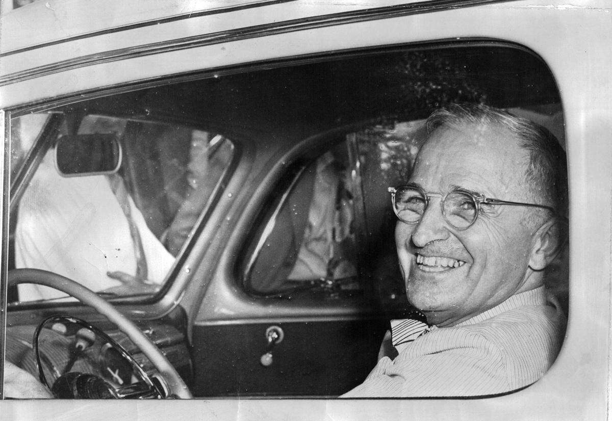 President Harry S. Truman at the wheel of his car in an undated photo.