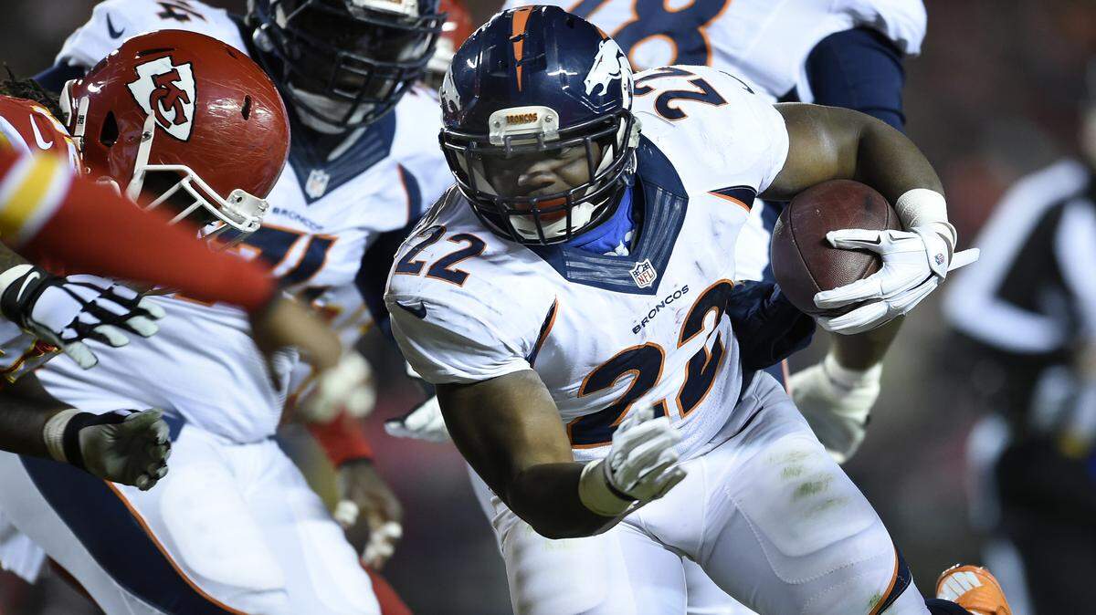 Denver Broncos running back C.J. Anderson (22) picks up four yards on a run in the first quarter during the Kansas City Chiefs and Denver Broncos football game at Arrowhead Stadium on Sunday, November 30, 2014, in Kansas City, Mo.