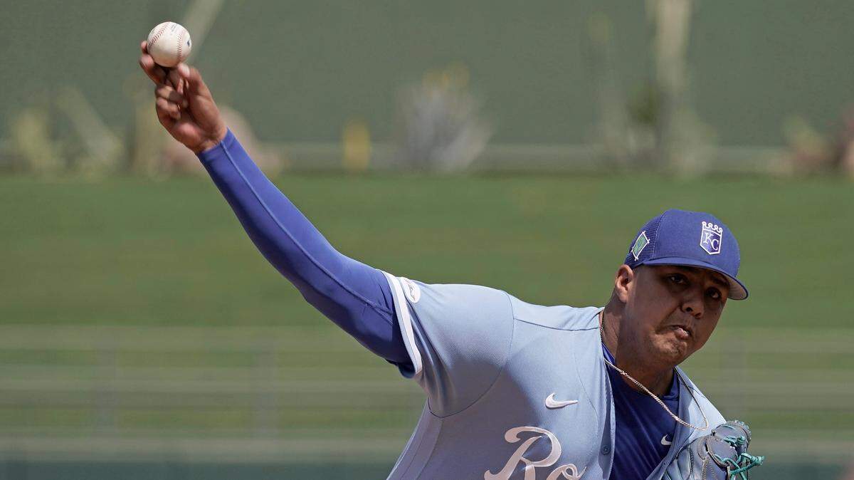 Kansas City Royals starting pitcher Carlos Hernandez throws during the first inning of a spring training baseball game against the Texas Rangers Friday, March 25, 2022, in Surprise, Ariz. (AP Photo/Charlie Riedel)
