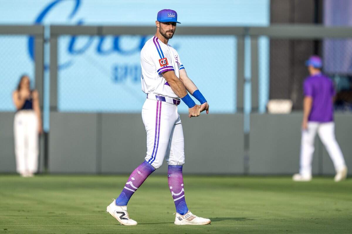 Kansas City Royals center fielder Kameron Misner (26), wearing the team's new "Forever Fountains" City Connect uniform, stretches before a game against the Houston Astros on Friday, June 12, 2026, at Kauffman Stadium in Kansas City.