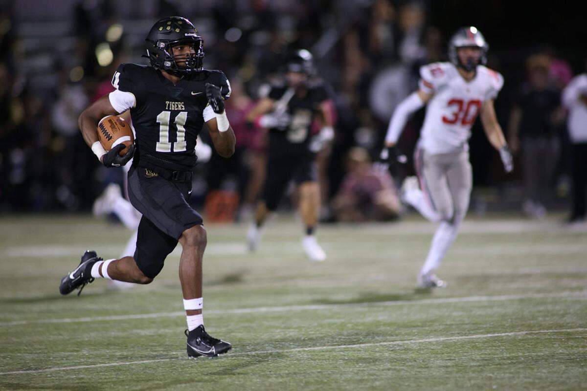 Martell Buchanan returns a kickoff for a touchdown during Blue Valley’s 40-28 win over Olathe West to open the Kansas Class 6A playoffs.