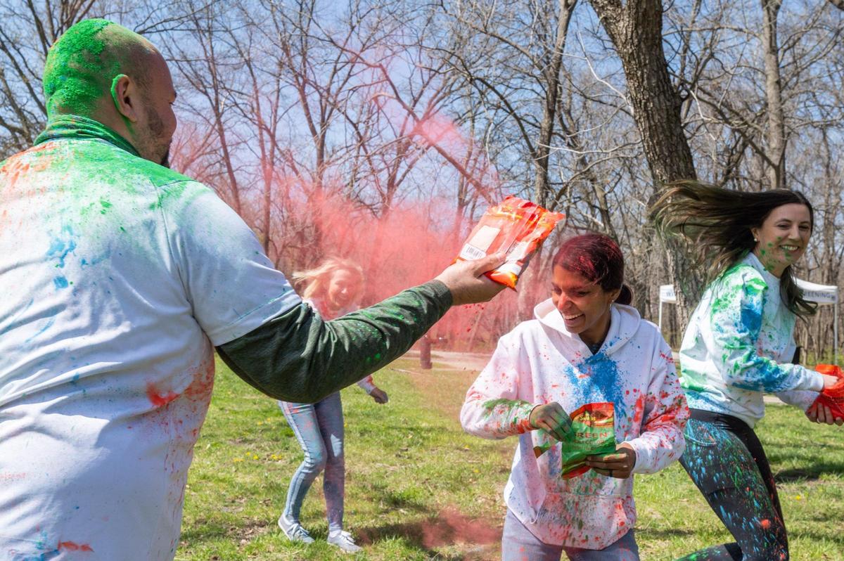 People celebrate the Hindu festival of Holi in Overland Park on Sunday.