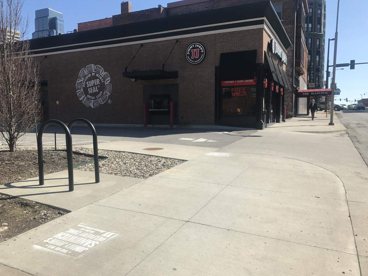 Two unlawful Jimmy John’s ads still remained Thursday afternoon near its location at 923 Broadway and down the block from a Subway.
