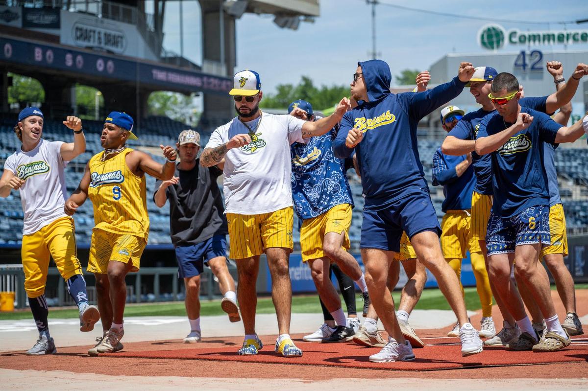 Savannah Bananas players practice a dance routine before a Banana Ball game against the Firefighters at Kauffman Stadium on Friday, May 23, 2025, in Kansas City.