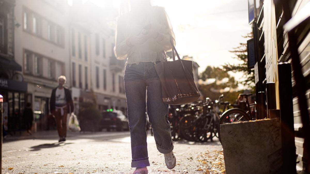 Woman walking down the street. (Photo by Quentin Top / Hans Lucas via AFP) (Photo by QUENTIN TOP/Hans Lucas/AFP via Getty Images)