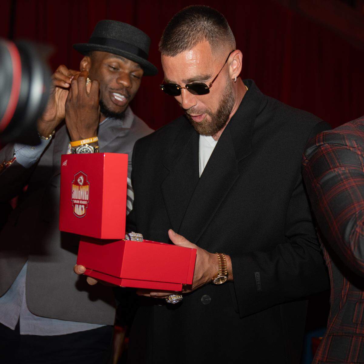 Travis Kelce looked inside the box holding his ring.