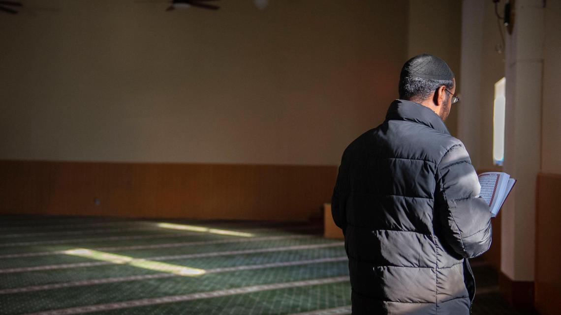 Abdinajib Dirir, a longtime Kansas City resident and board member of Masjid Al-Huda, prepares for prayer at the Somali-majority mosque on Friday, Dec 10, 2021. Several of the mosque’s community members, including Dirir’s son, have been victims of gun violence.
