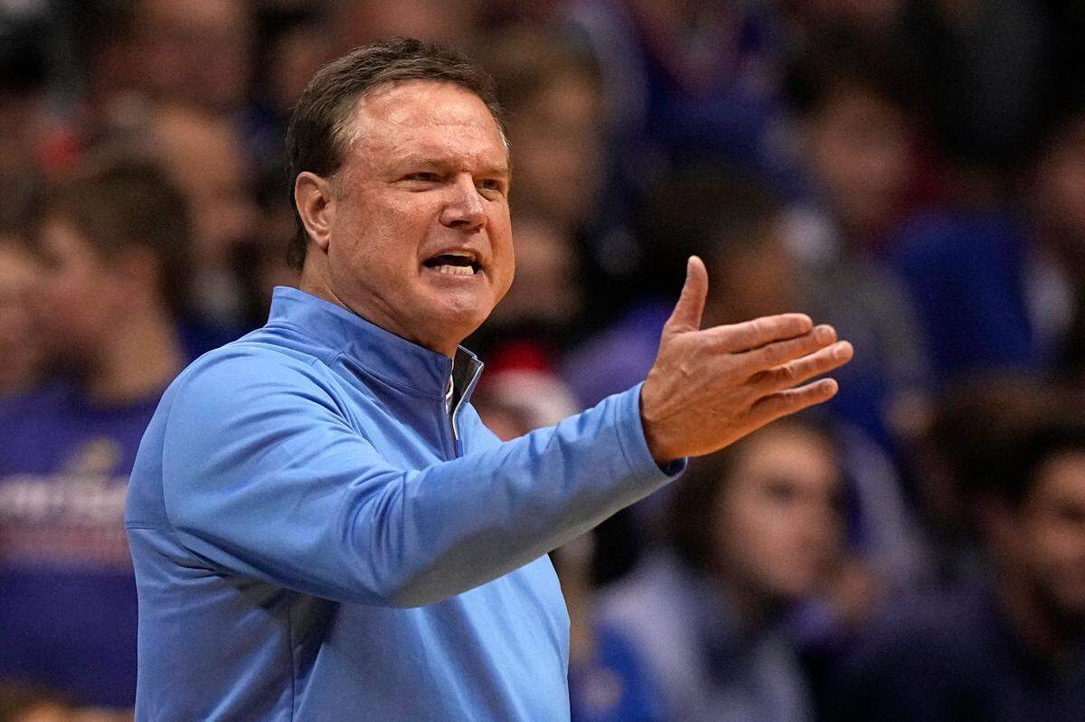 Kansas head coach Bill Self talks to his players during the second half of an NCAA college basketball game against Stephen F. Austin Saturday, Dec. 18, 2021, in Lawrence, Kan. (AP Photo/Charlie Riedel)