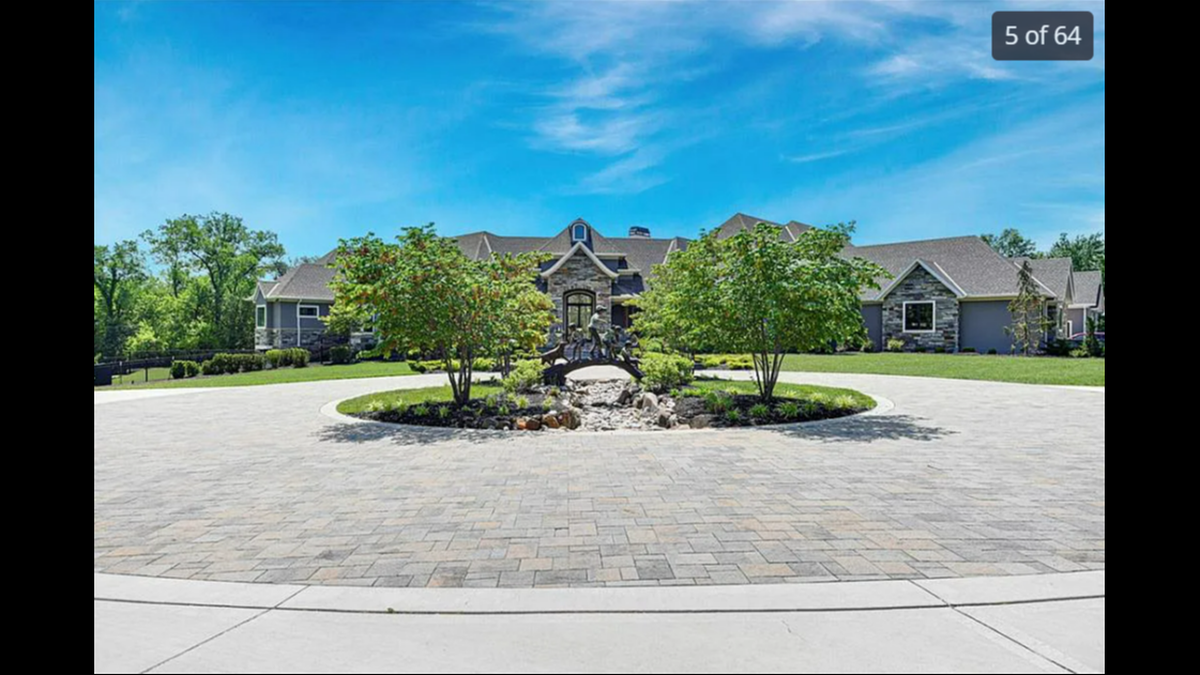 The bronze statue outside 9925 W. 159th St. in Overland Park. The house has over 13,000 square feet of space, including a basketball court and outdoor pool.