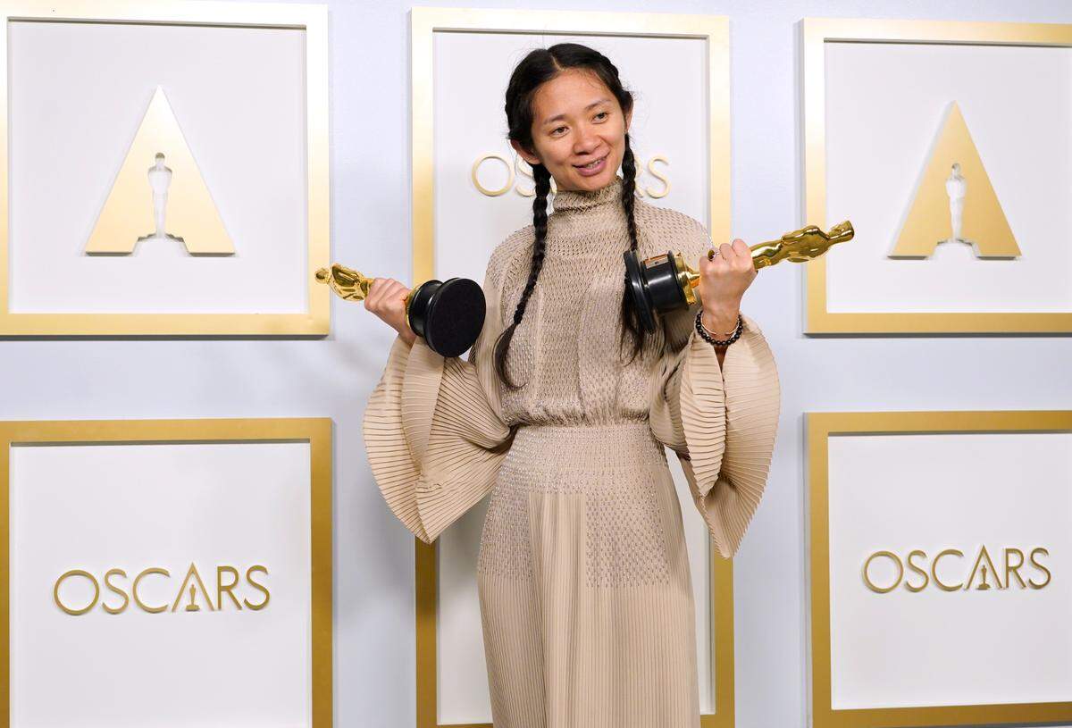 Chloe Zhao, winner of the awards for best picture and director for “Nomadland,” poses in the press room at the Oscars on Sunday, April 25, 2021, at Union Station in Los Angeles.