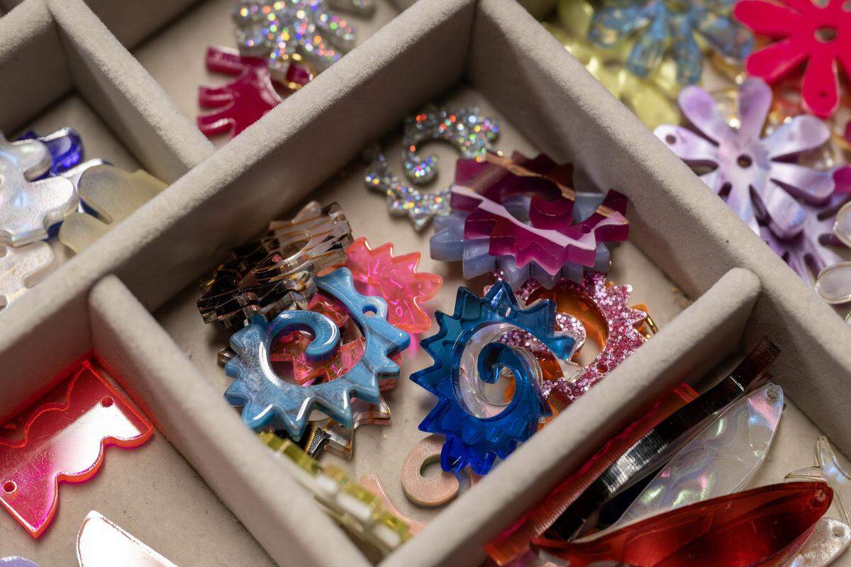 Caracol charms are seen in a storage container at Paulina Otero's studio on Tuesday, March 3, 2026, in Kansas City.