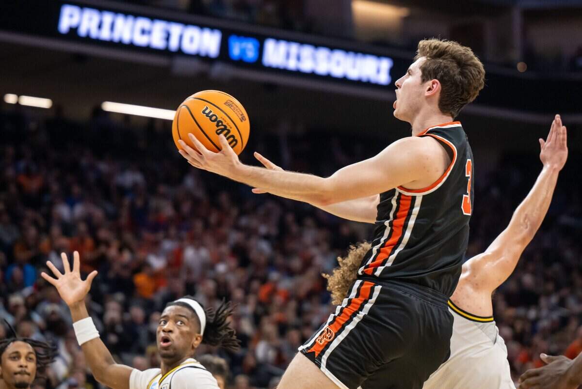 Princeton Tigers guard Ryan Langborg (3) goes up for an uncontested two points past Missouri Tigers forward Noah Carter (35), right, during the first half of their NCAA Tournament game at Golden 1 Center on Saturday, March 18, 2023, in Sacramento.
