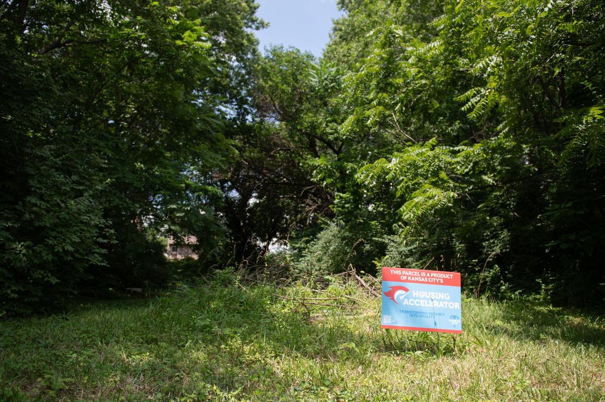 Signs announcing a city housing accelerator program to entice builders to erect houses on vacant lots have been placed along Agnes Avenue and blocks between 20th street and 19th street in Kansas City.
