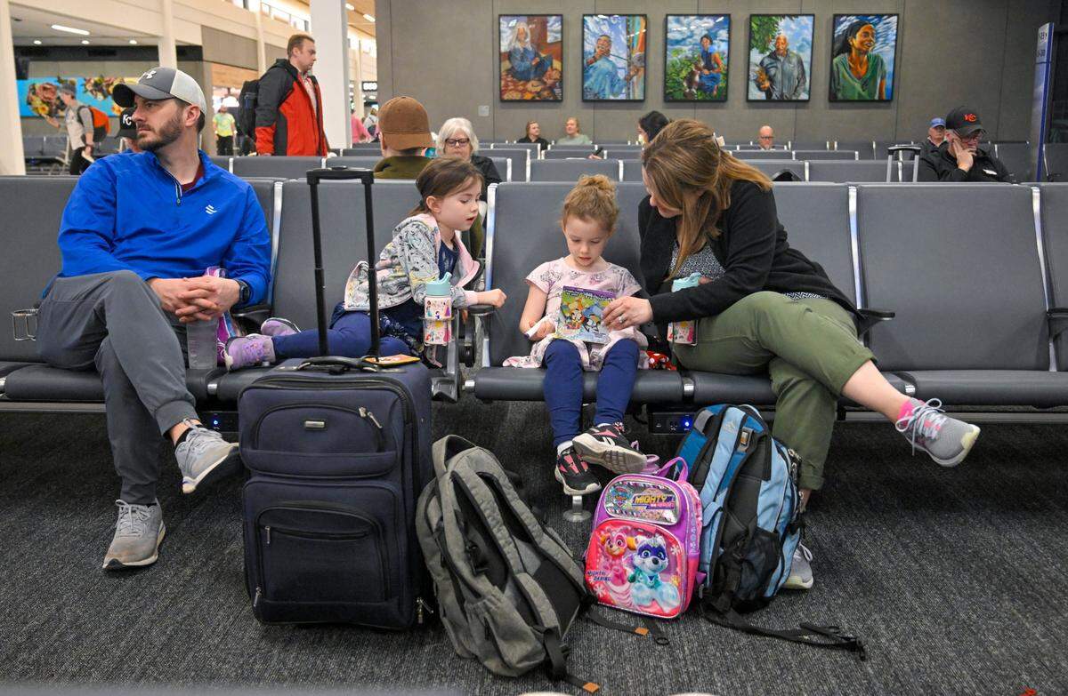 Travelers including Chris and Jessica Woolery of Olathe waited for a flight to Orlando with their daughters Brookly, 7, and Hayden, 4, at the new $1.5 billion single terminal at Kansas City International Airport on Tuesday, Feb. 28, 2023. “It was so easy,” said Jessica Woolery. “It’s beautiful, amazing.”