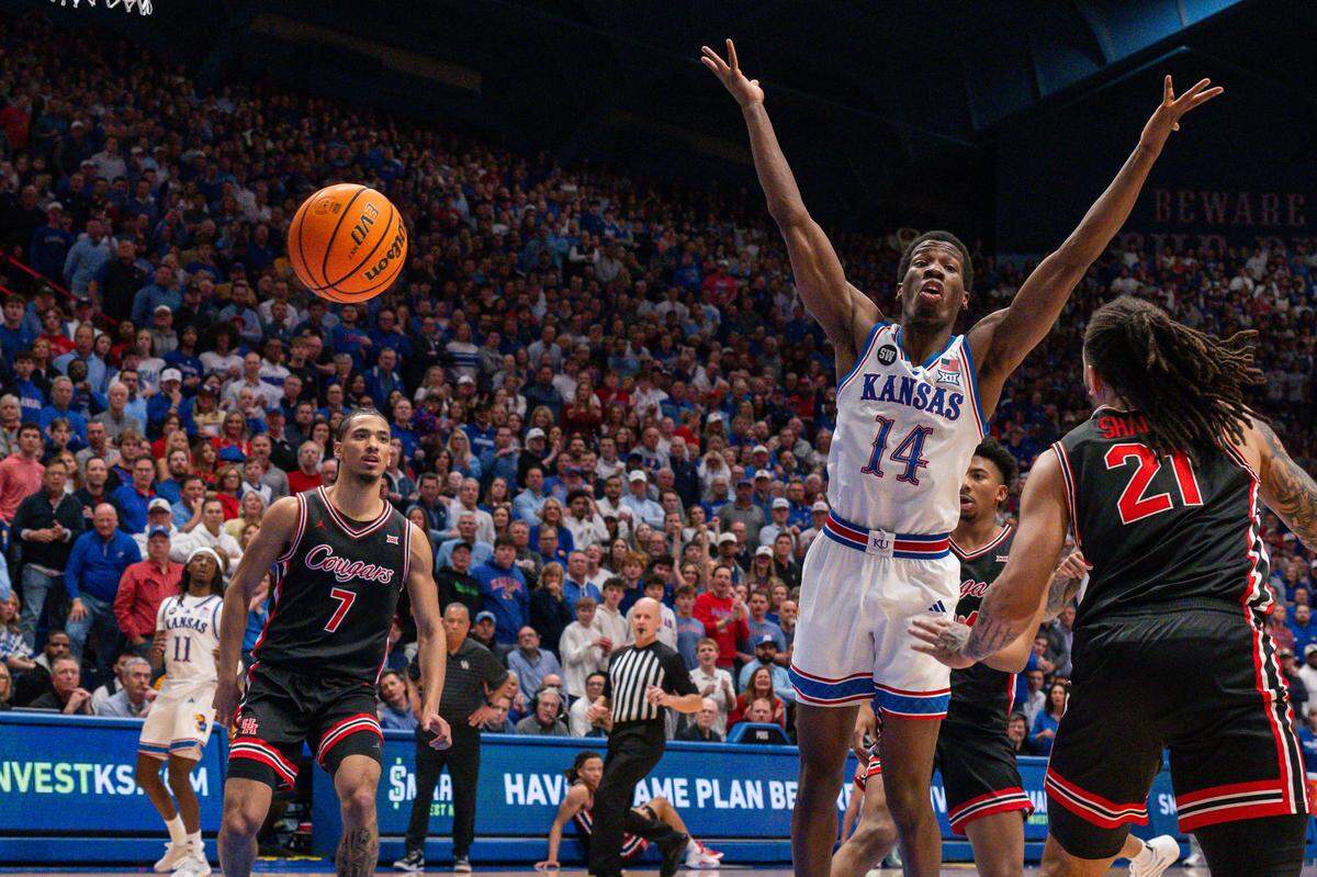 Kansas Jayhawks guard Melvin Council Jr. (14) gets the ball stripped in the first half vs. the Houston Cougars on Monday, February 23, 2026, at Allen Fieldhouse.