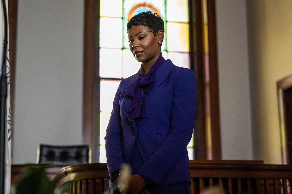 Melesa Johnson bows her head in prayer before being sworn in as Jackson County Prosecutor on Friday, Jan. 3, in the Historic Brady Courtroom at the Truman Courthouse in Independence.