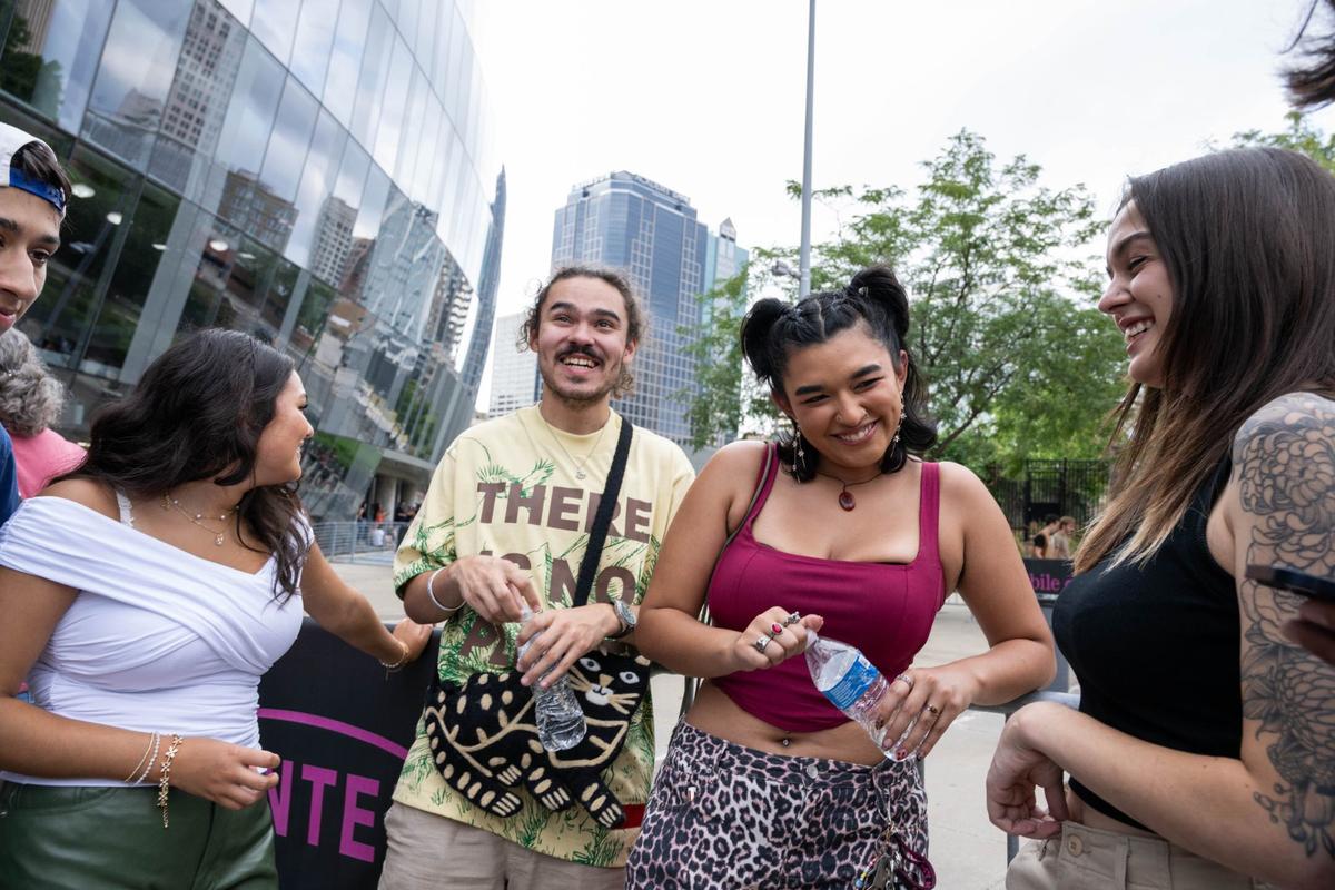 Leila, Evie, and Nina Hussaini, and Michael Houser share a laugh before the Childish Gambino at the T-Mobile Center in Kansas City on Monday August 12, 2024. The three sisters have been fans of Gambino’s since his album “Because Of The Internet”