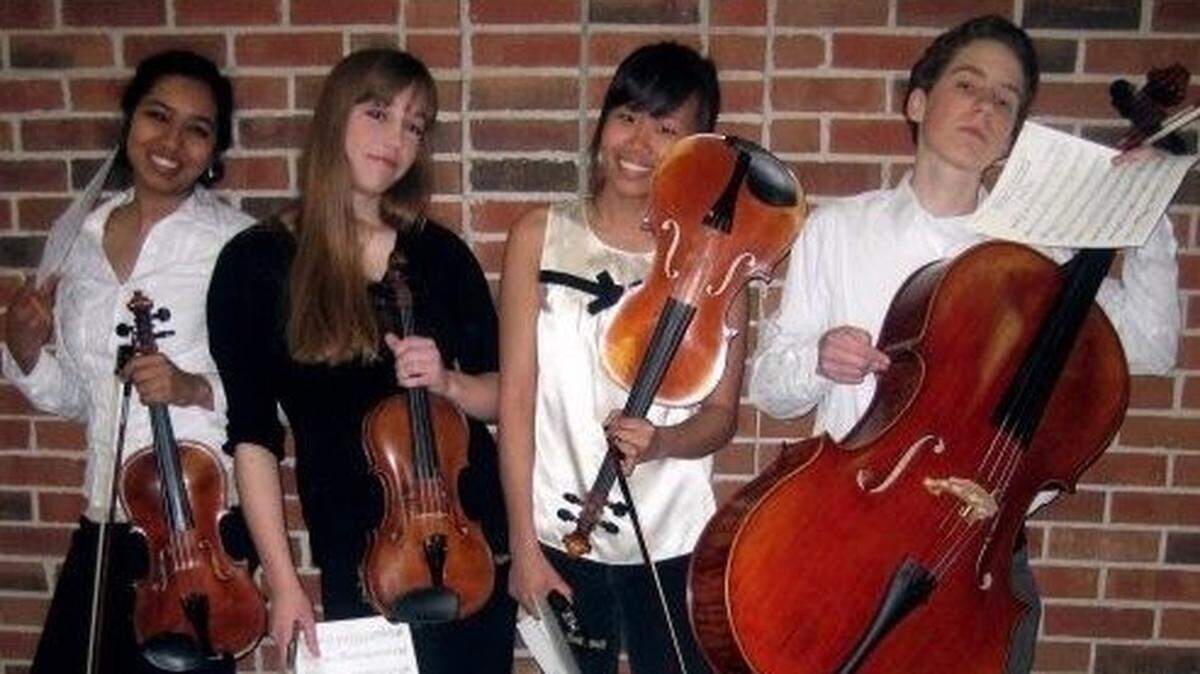 This student string quartet from Blue Valley Northwest, circa 2008, appears for a brief second in a Super Bowl promotion for Usher’s Super Bowl halftime show. From left: Sameera Mangena, Sydney Menees, Maggie Alexander and Nathan Hoffmann.