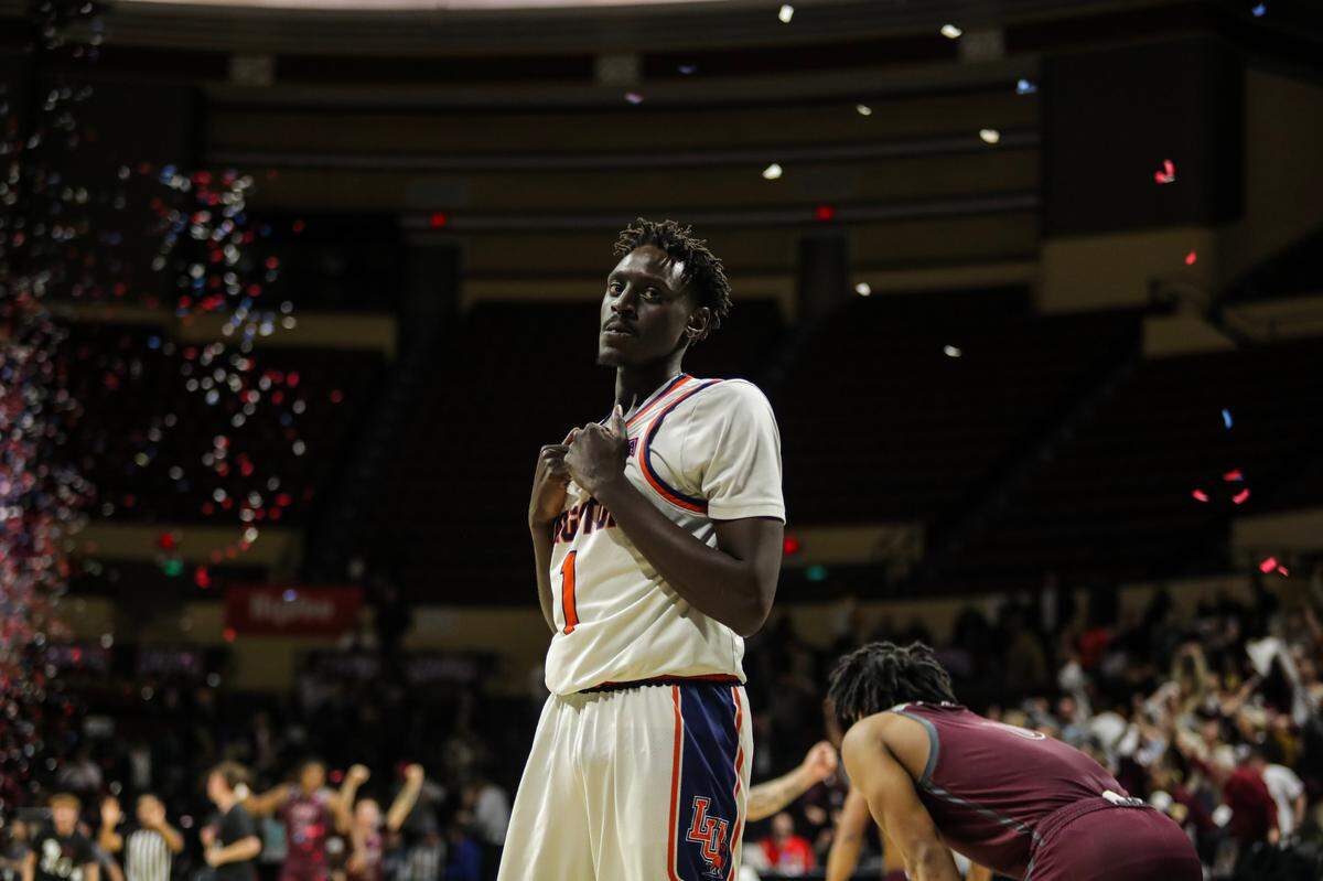 Majok Kuath of Langston reacts as the confetti rains down in celebration of Freed-Hardeman’s NAIA national championship win Tuesday, March 26, 2024, at Municipal Auditorium.