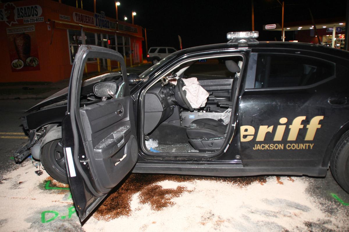 A photo from a police investigative file shows damage to a Jackson County Sheriff’s Office vehicle after the crash in 2017.