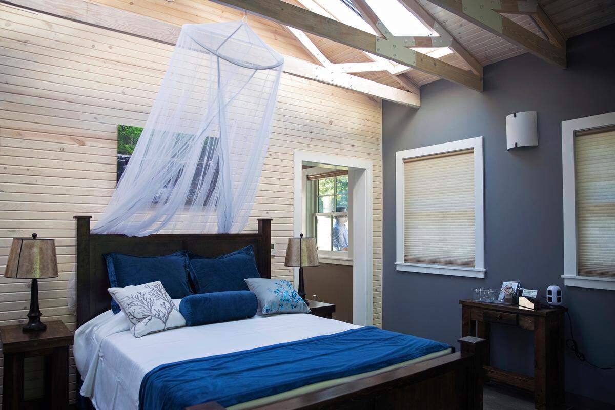 This photo shows a queen bed on rollers at the new glamping cabins at Platte River State Park shown in Louisville, Nebraska. The park recently completed three glamping cabins, available for $165 per night.