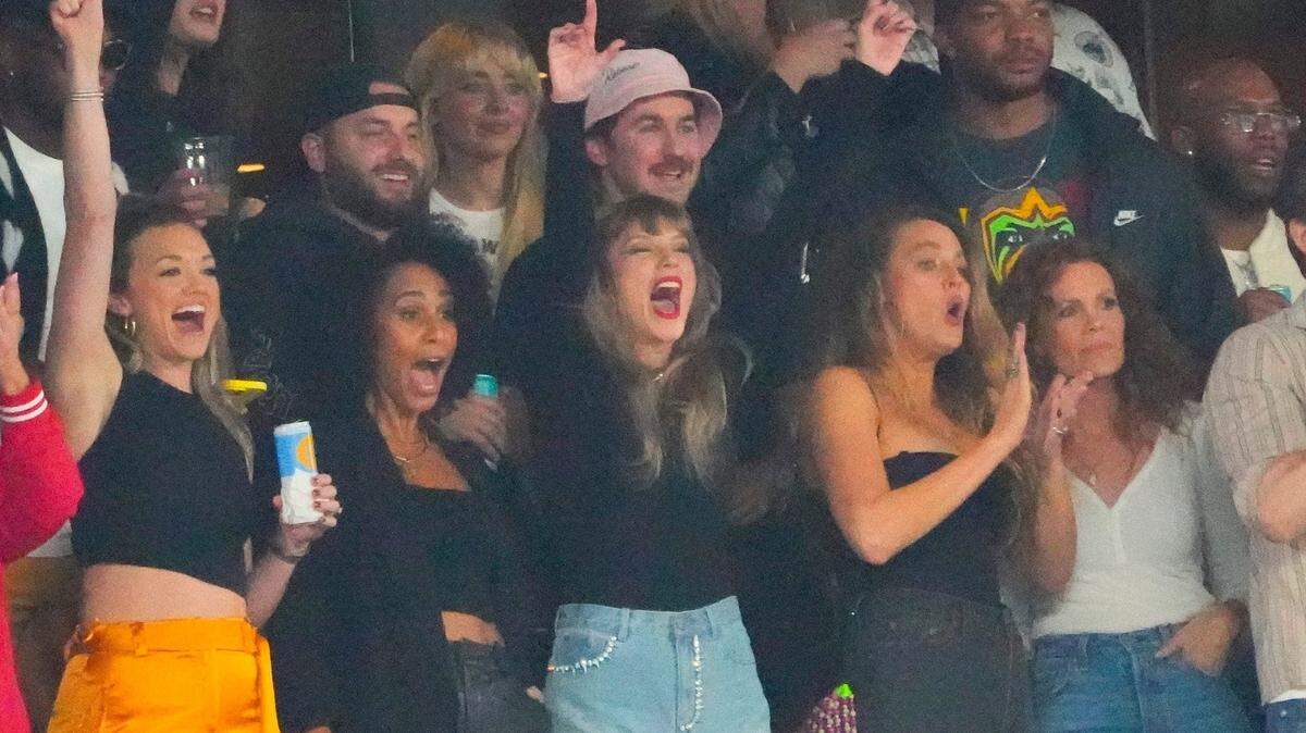Taylor Swift, a guest of Kansas City Chiefs tight end Travis Kelce, cheers during the “Sunday Night Football” game against the New York Jets at MetLife Stadium. Swift reportedly made a secret trip to Kansas City last week, according to tabloids.