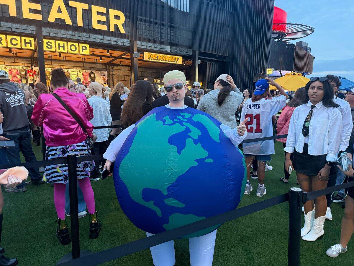 Faith Zavala dressed like the earth for the Pitbull Concert at Morton Amphitheater on Friday, Sept. 25, 2026, in Riverside.