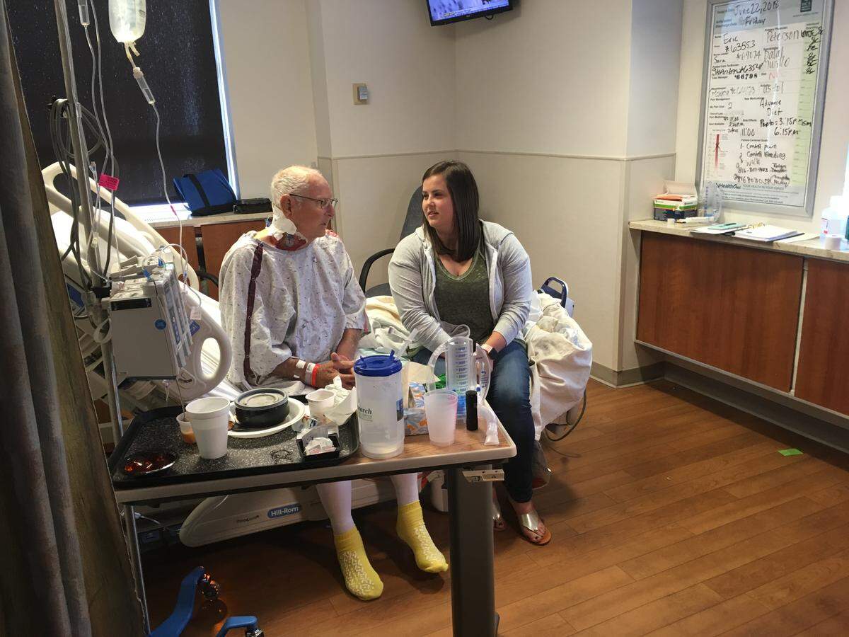 Kenneth Hensley of Albany, Mo., talks to granddaughter Kristi Neth on Friday. Hensley received a kidney from a stranger this week as part of an eight-person transplant chain at Research Medical Center. His grandson donated a kidney to a stranger.