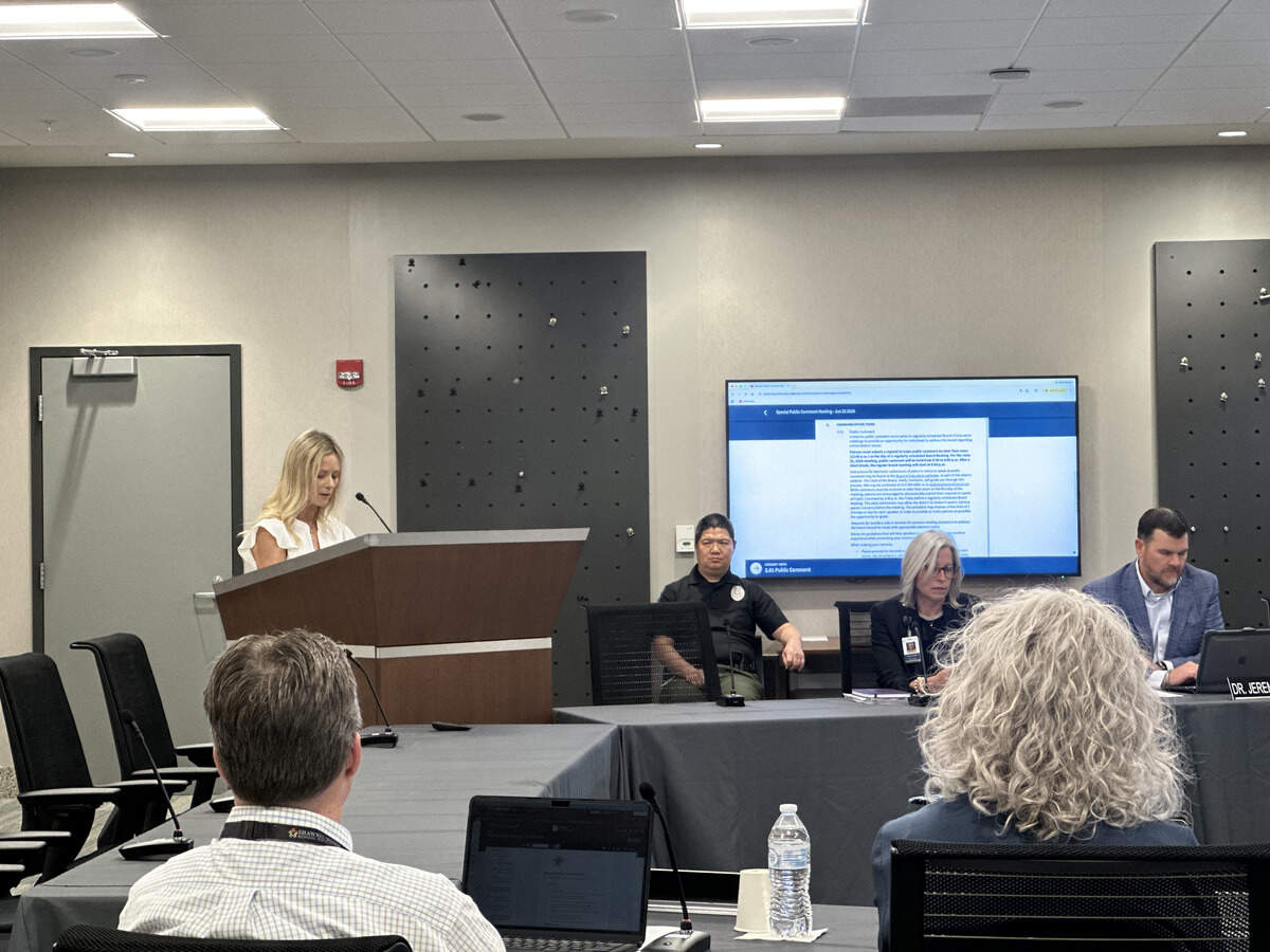 Rebecca Ferguson speak at the Shawnee Mission School District public comment meeting on June 22. Ferguson highlighted data she has found that suggests over reliance on technology can be harmful to child development.