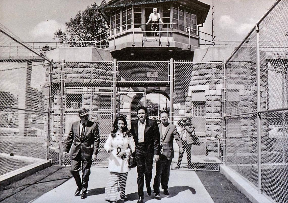 A photo from May 15, 1970, shows Johnny Cash and his wife, June Carter, leaving the Kansas State Penitentiary after he performed for inmates inside the prison. The photo is on display at the Lansing Historical Society Museum.