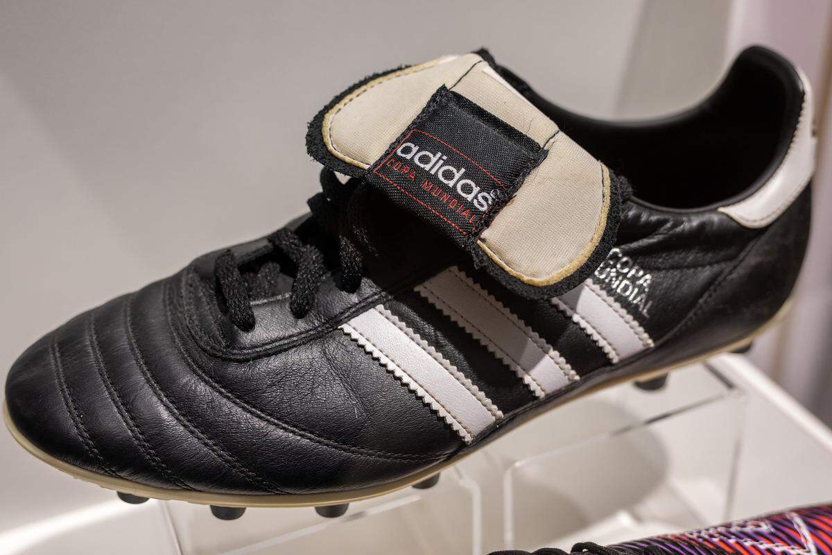 Adidas football cleats are displayed in the new exhibition “The Beautiful Game,” highlighting the role of soccer during World War I, at the National WWI Museum and Memorial on Wednesday, April 1, 2026, in Kansas City.