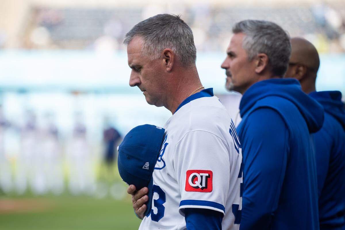 Kansas City Royals manager Matt Quatraro holds his hat over his heart during the national anthem prior to the Royals game vs. the Boston Red Sox on Wednesday, May 20, 2026, at Kauffman Stadium.