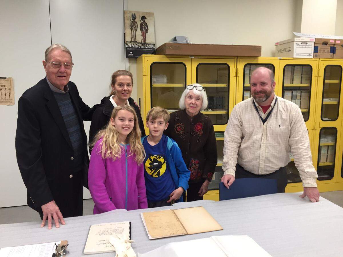 Heywood "Woody" Davis (from left) of Kansas City, with his daughter, Lynne Boyle, grandchildren Cecily and Brennan Hawkins Boyle and wife, Louise Davis, presented the family's Revolutionary War journal to historian Philip Mead at the Museum of the American Revolution in Philadelphia.
