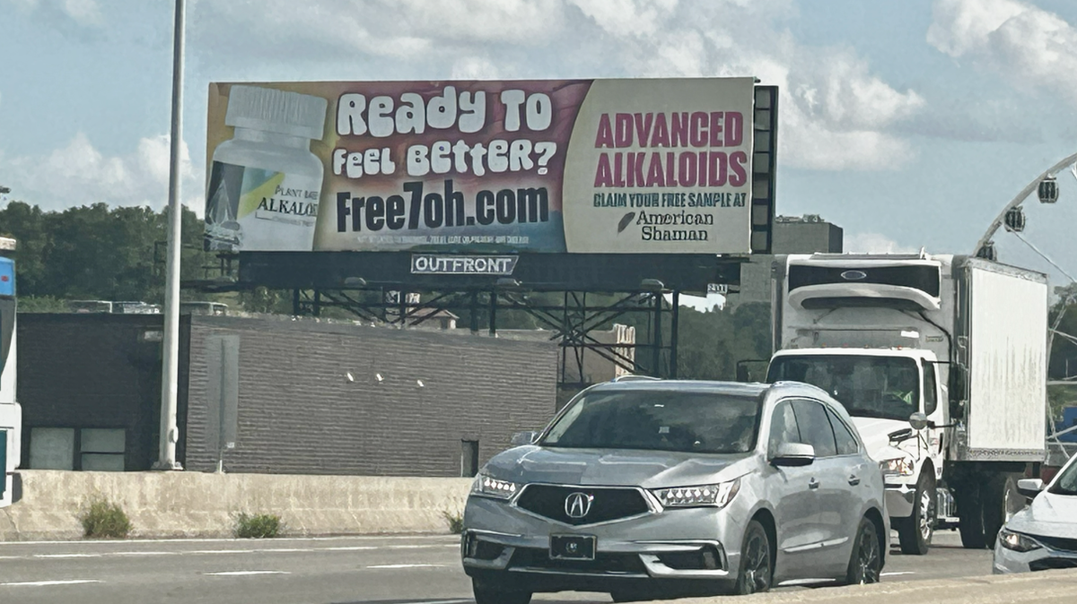 An American Shaman billboard advertising 7-OH on Interstate 35 near Kansas City’s Crossroads.