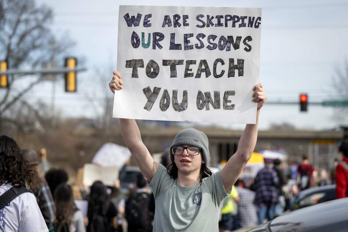 Johnson County teens protest ICE with student-led march | Kansas City Star