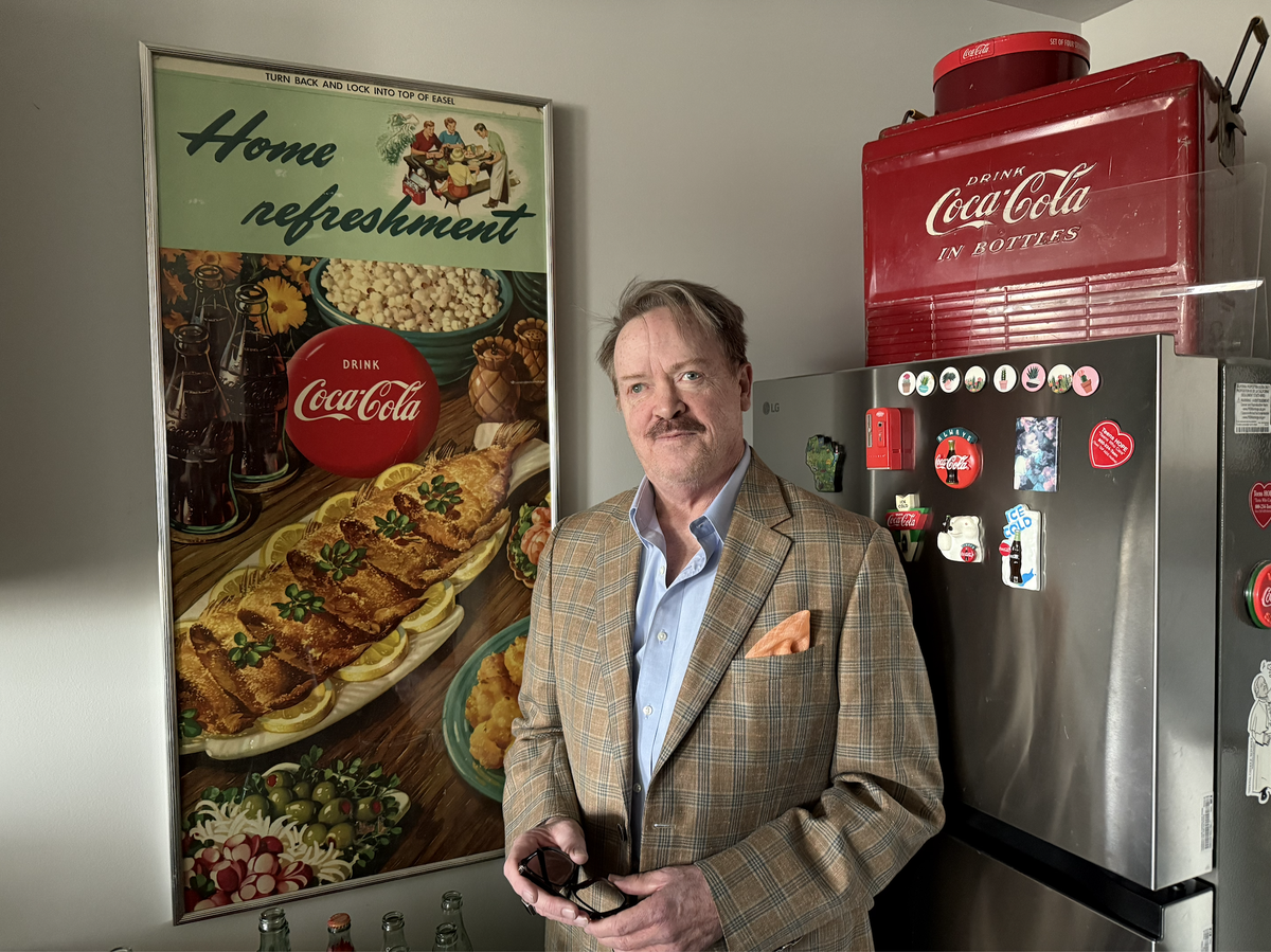 William Dittman, the first person to move into the new City Hall Place affordable housing development in Kansas City, Kansas, has filled his new apartments with decades worth of Coca Cola memorabilia.