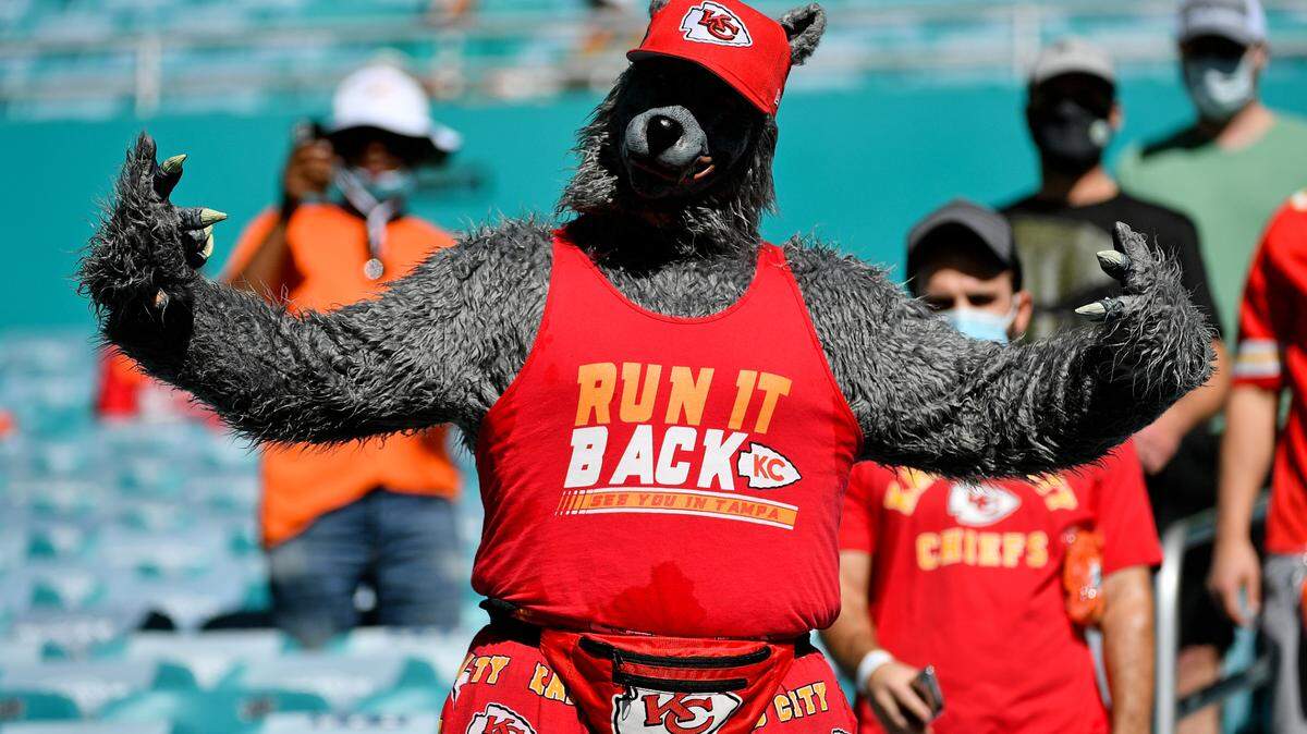 A Kansas City Chiefs fan dressed as a wolf poses for a photo while attending the game between the Miami Dolphins and the Kansas City Chiefs at Hard Rock Stadium.