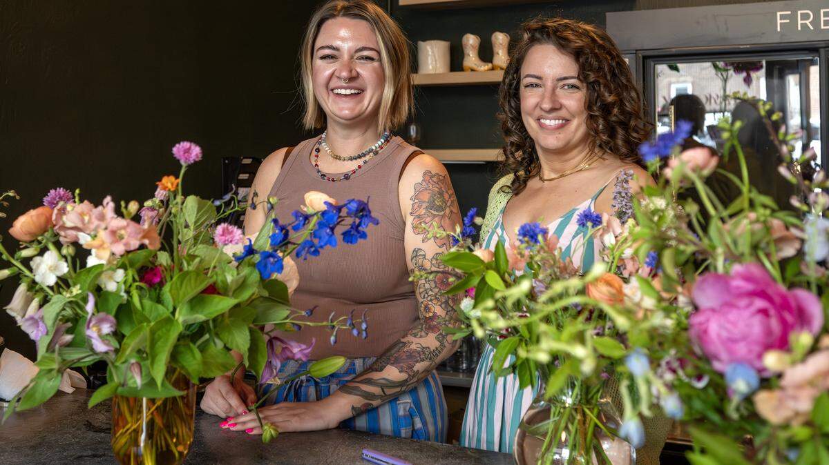 Betsy Ford, left, and Lily Williams, co-owners of Lily Floral Collective, stand for a portrait on Friday, May 8, 2026, in Kansas City.
