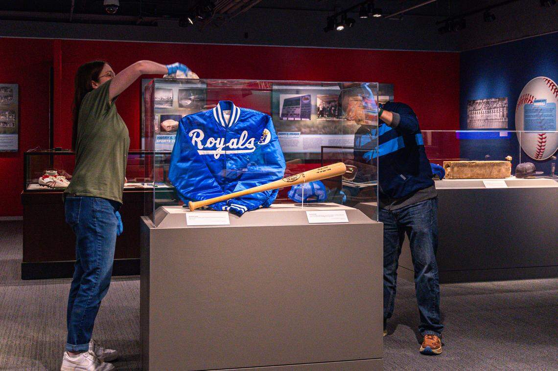 Workers at the Harry S. Truman Presidential Library & Museum in Independence fine-tune a Royals display located inside an exhibit entitled “United We Play,” showcasing the former American president’s impact on the Kansas City regional sports scene.