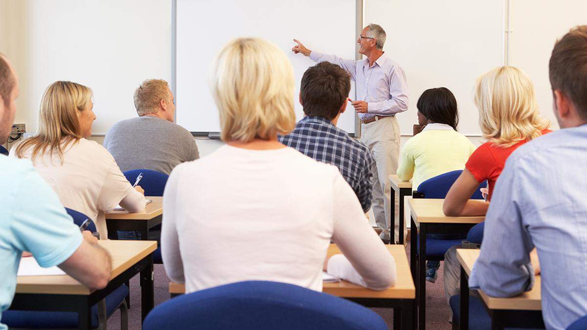 Senior tutor teaching class adult older education nontraditional student