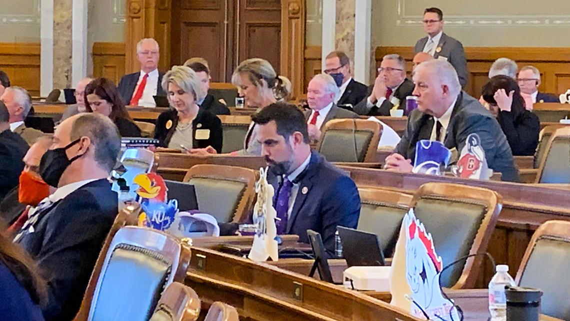 Kansas Rep. Mark Samsel, center, in the House chamber on Monday. Samsel was arrested last week following videos showing bizarre behavior while substitute teaching.
