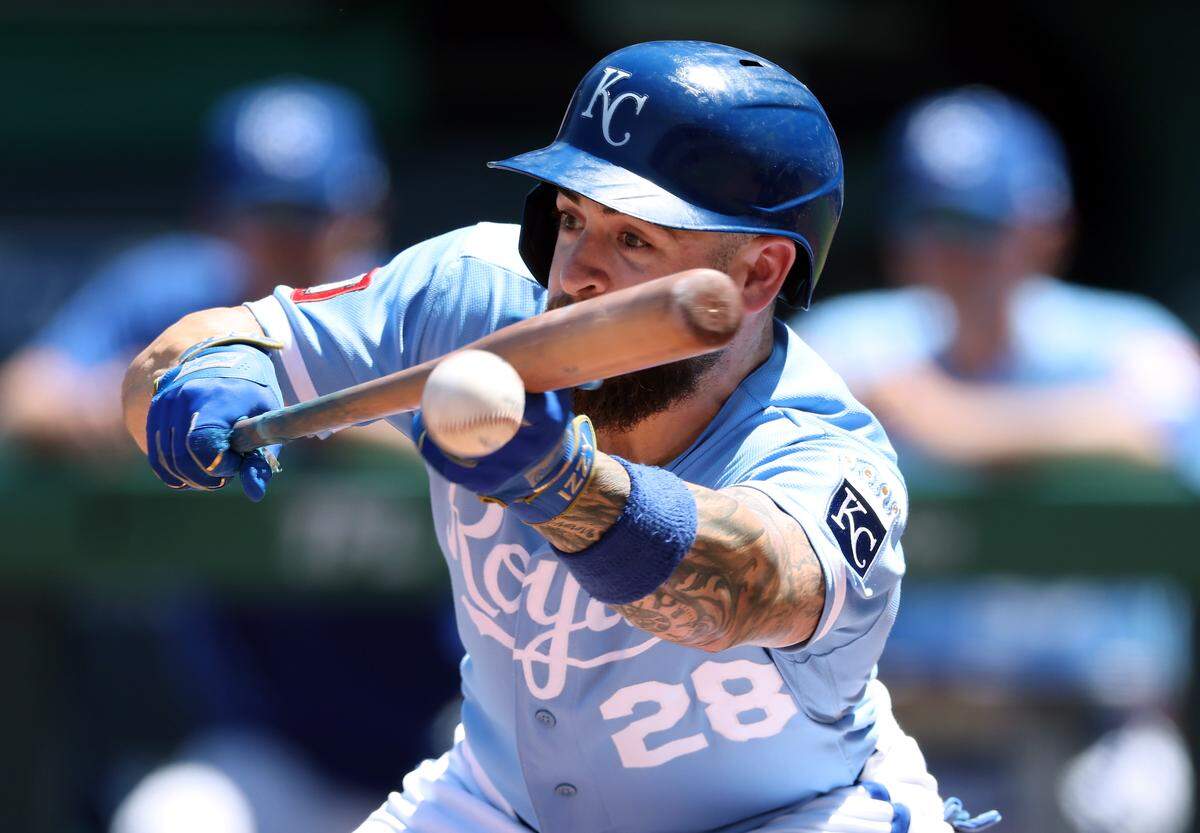 Royals center fielder Kyle Isbel bunts for a single during the fifth inning of an 8-6 win against the Seattle Mariners at Kauffman Stadium in Kansas City on Sunday, May 24, 2026.
