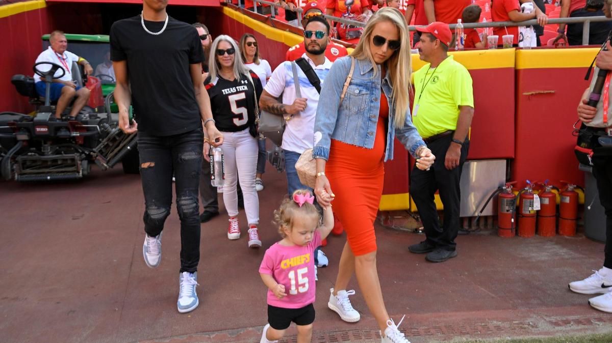 Family members of Kansas City Chiefs quarterback Patrick Mahomes including brother Jackson Mahomes, wife Brittany Mahomes and daughter, Sterling, headed to the field after the Chiefs defeated the Commanders, 24-17, on Saturday, Aug. 20, 2022, at Arrowhead Stadium.